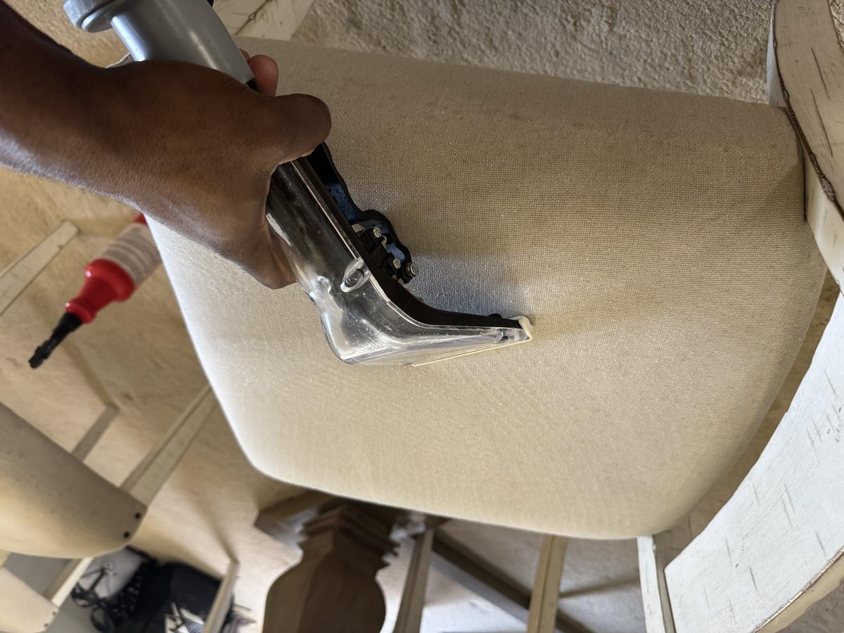 Upholstery cleaning in progress with RF extraction wand